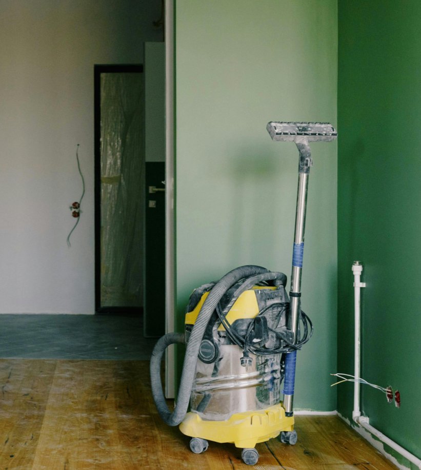 Vacuum cleaner on a wooden floor